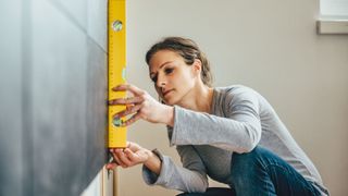 Woman measuring surfaces