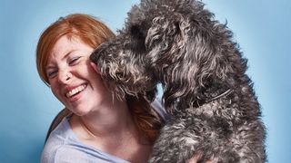 Dog licking owner