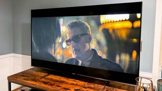 Hisense U8H Mini-LED TV on living room tv stand