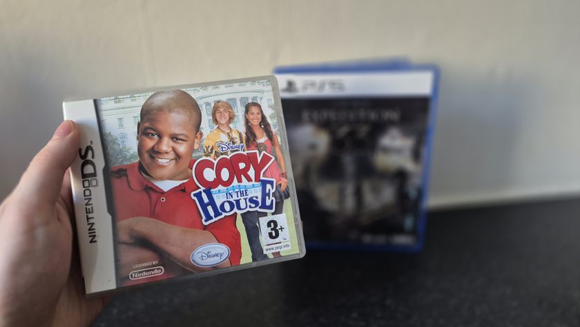 Man holding up Cory in the House for the Nintendo DS game box in front of Clair Obscur: Expedition 33 game box