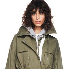 a model wearing the gap x victoria beckham collaboration jacket and hoodie