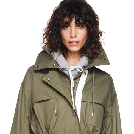 a model wearing the gap x victoria beckham collaboration jacket and hoodie