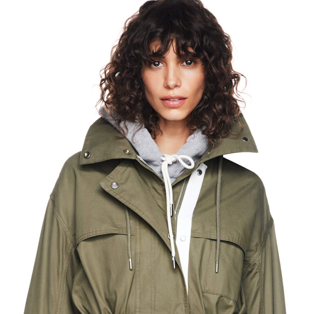 a model wearing the gap x victoria beckham collaboration jacket and hoodie