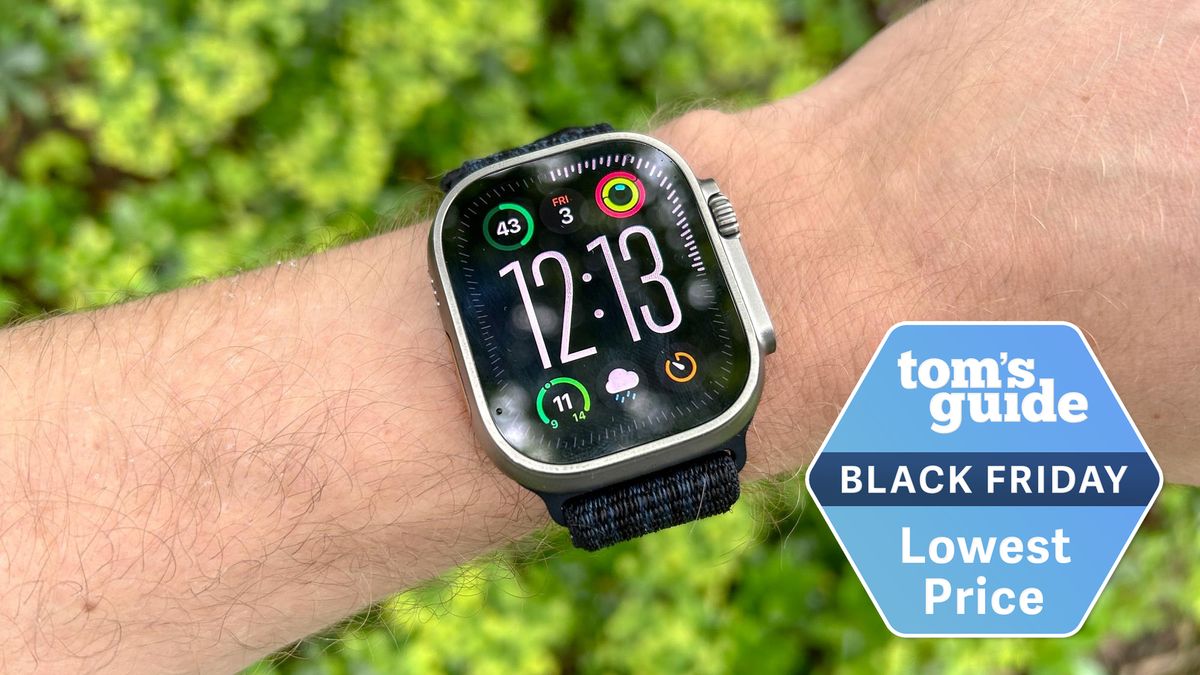 Apple Watch Ultra 2 on a person&#039;s wrist with Tom&#039;s Guide Black Friday badge