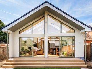 exterior of modern house with lots of glazing and white render