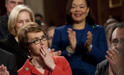 Rep. Gabrielle Giffords (D-Ariz) receives a standing ovation from members of Congress on Tuesday, a day before handing in her resignation to focus on her recovery.