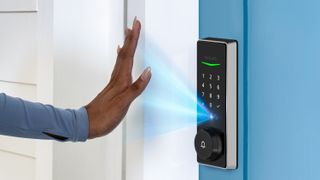 Woman using palm to open Philips 5000 Series Smart Lock