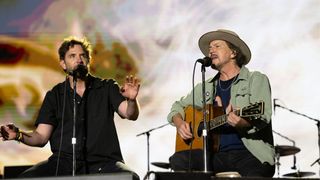 Actor Bradley Cooper (L) and singer, songwriter and guitarist Eddie Vedder of Pearl Jam perform a duet live on stage during BottleRock at Napa Valley Expo on May 25, 2024 in Napa, California