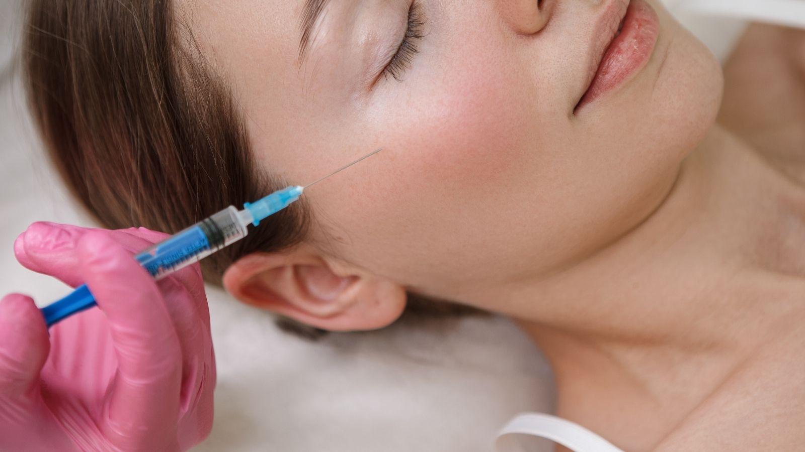 A woman receiving dermal fillers