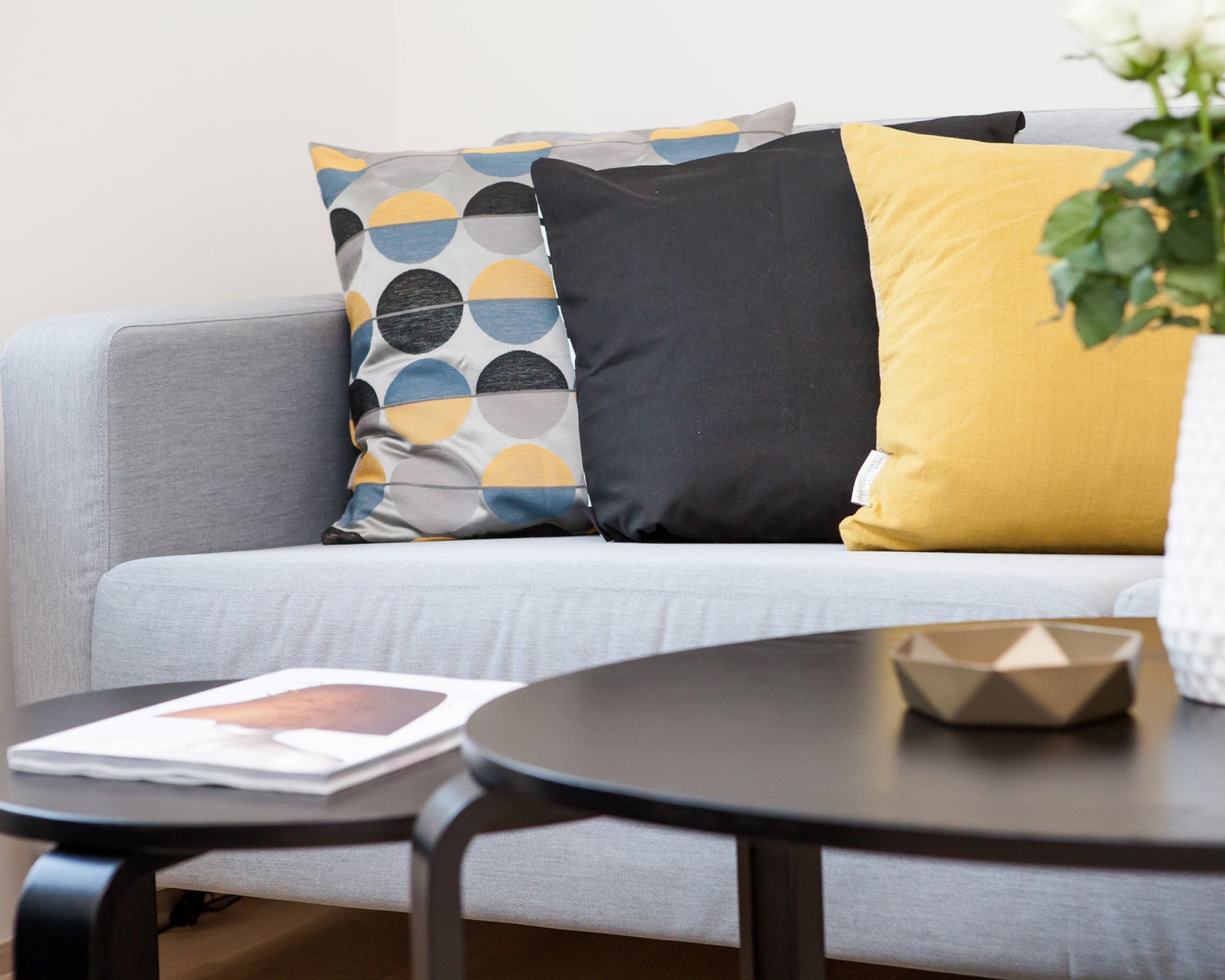 Living room with round coffee tables and cushions