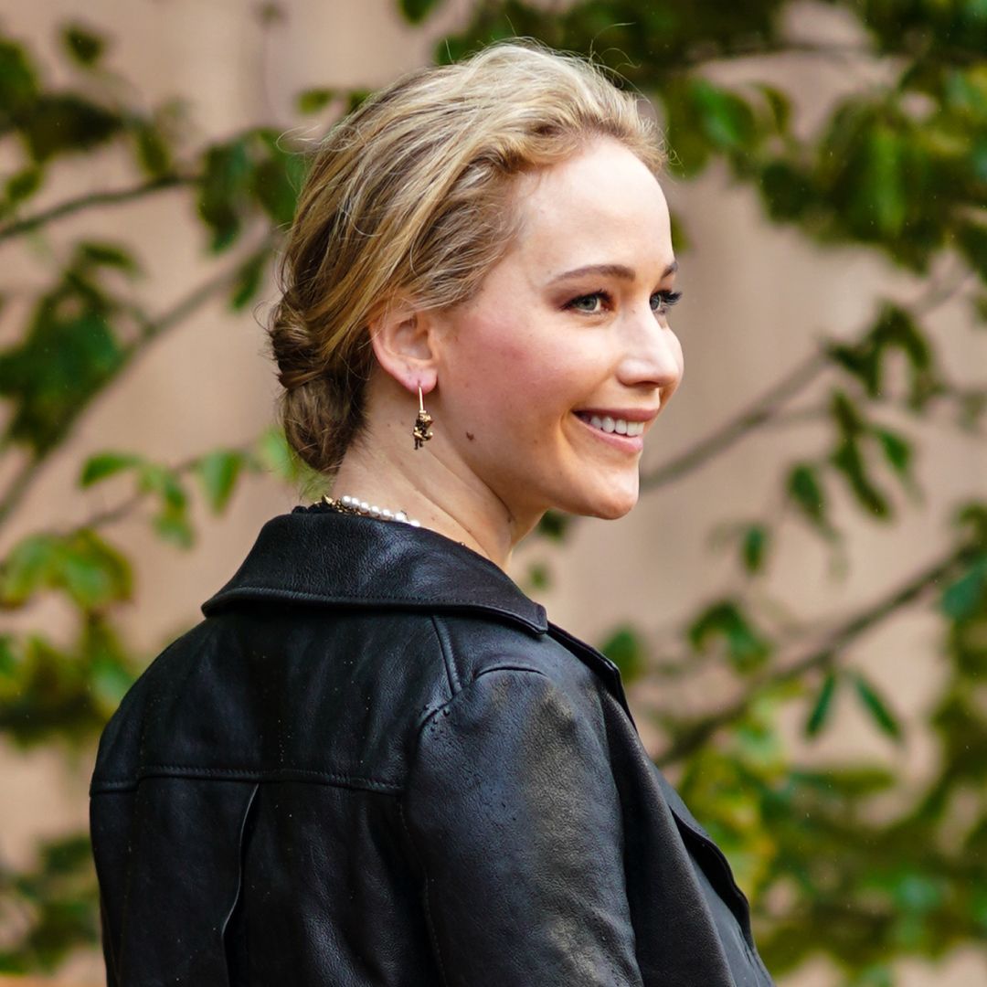 Jennifer Lawrence wearing a leather jacket and jeans