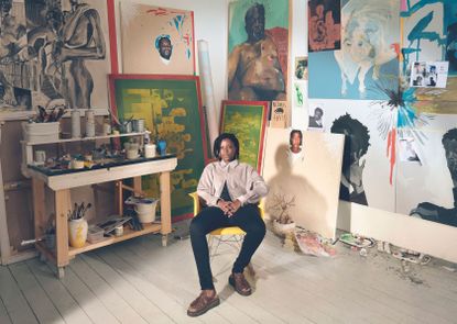 Kudzanai-Violet Hwami photographed in her studio in Vauxhall, London, with completed works and works in progress, including one of the artist’s mother 