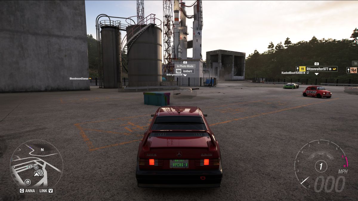 Forza Horizon 6 Nangan Treasure Hunt: A red car parked next to a colourful treasure chest at Irokawa Space Center.