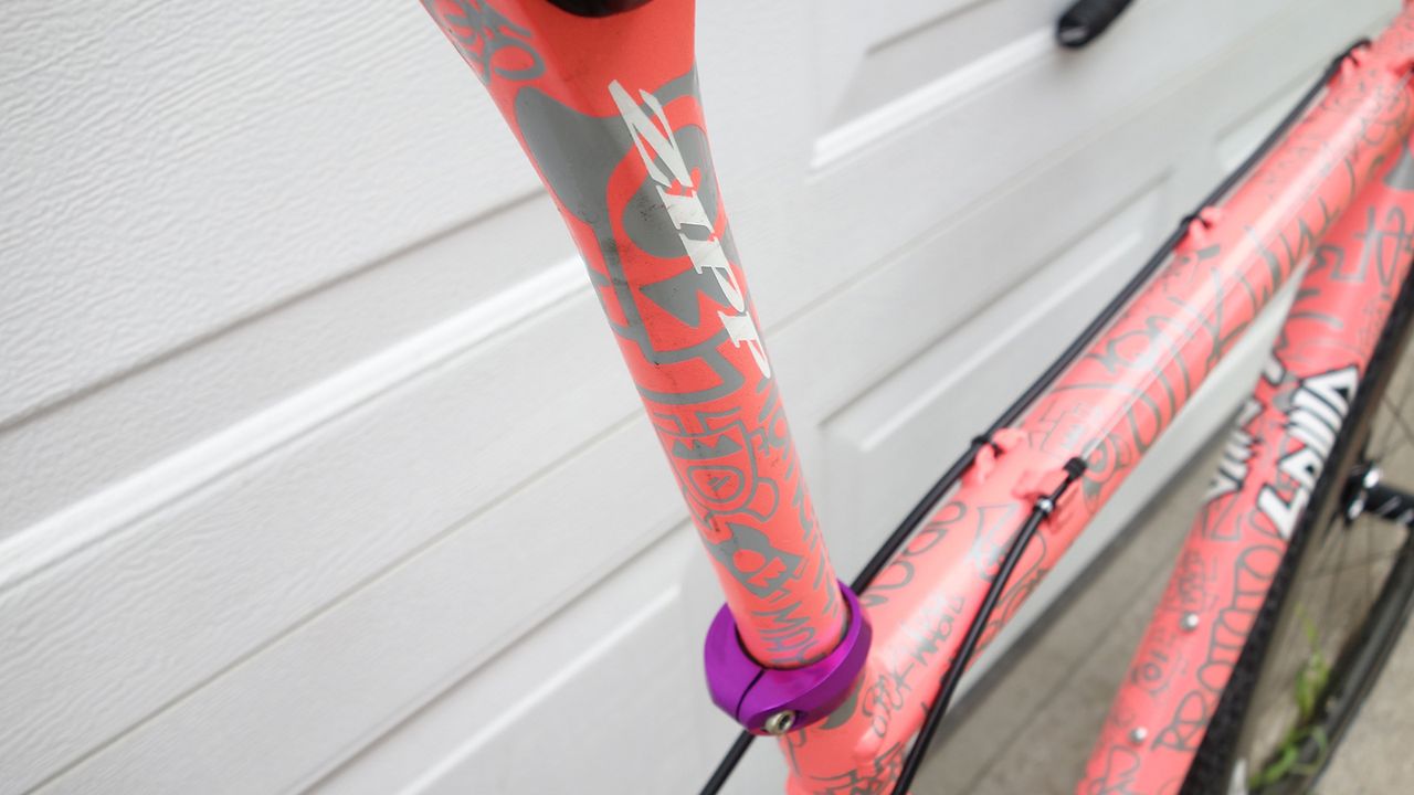 A Zipp Service Course seat post has had the same custom treatment