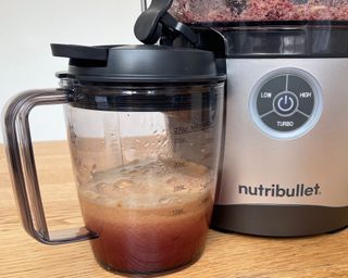 Freshly-pressed apple juice made using Nutribullet Pro, the image shows pulp fruit fiber and jug with end product
