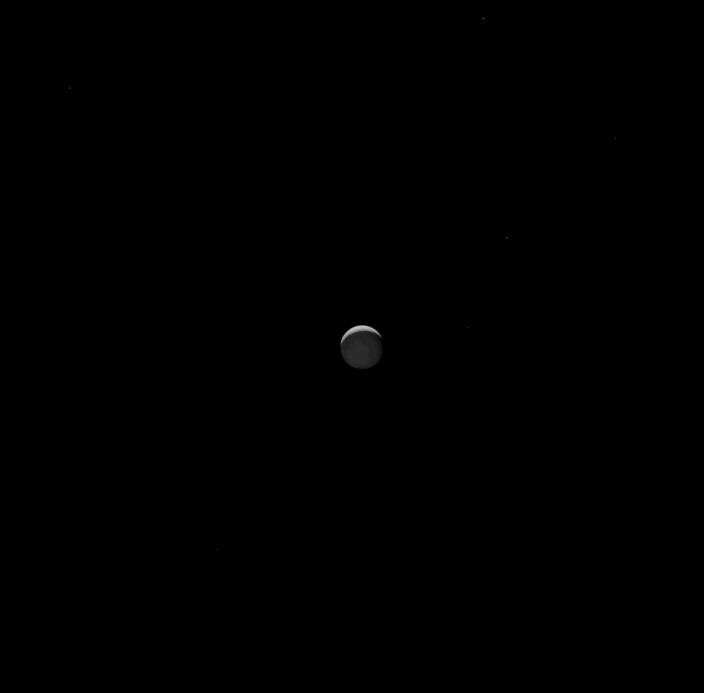 Enceladus sets behind Saturn in this view from NASA's Cassini spacecraft on Sept. 13, 2017.
