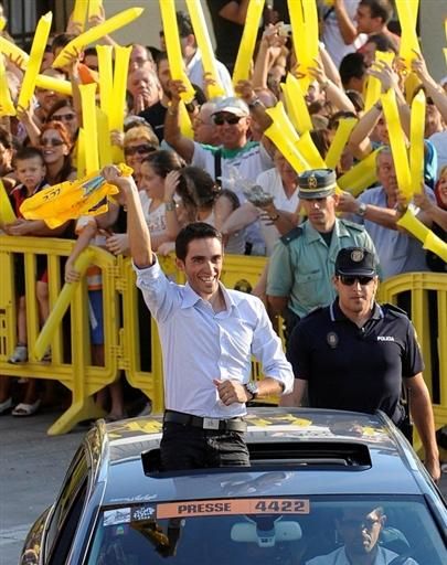 Alberto Contador waves to fans as he's driven through his home town of Pinto, Spain on Monday
