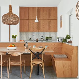 Kitchen with white wall and wooden cabinet