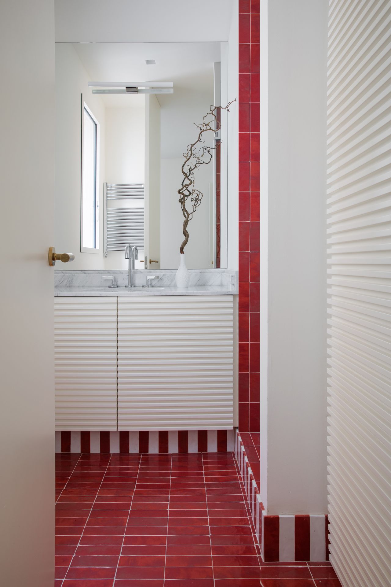 A red tiled bathroom