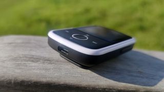 The Majority MP3 Player on a wooden bench.