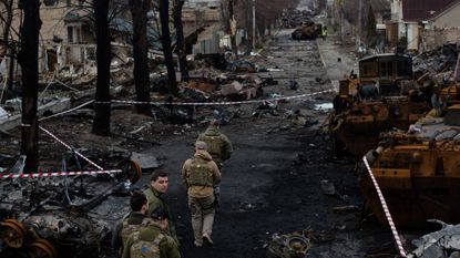 Ukrainian servicemen on the streets of Bucha