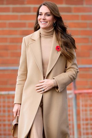 Catherine, Princess of Wales wears a camel coat and matching top as she visits 'The Street' community hub during an official visit to Scarborough on November 3, 2022 in Scarborough, England.