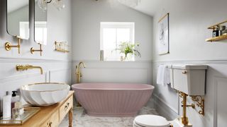 pale grey bathroom with pink fluted freestanding bath