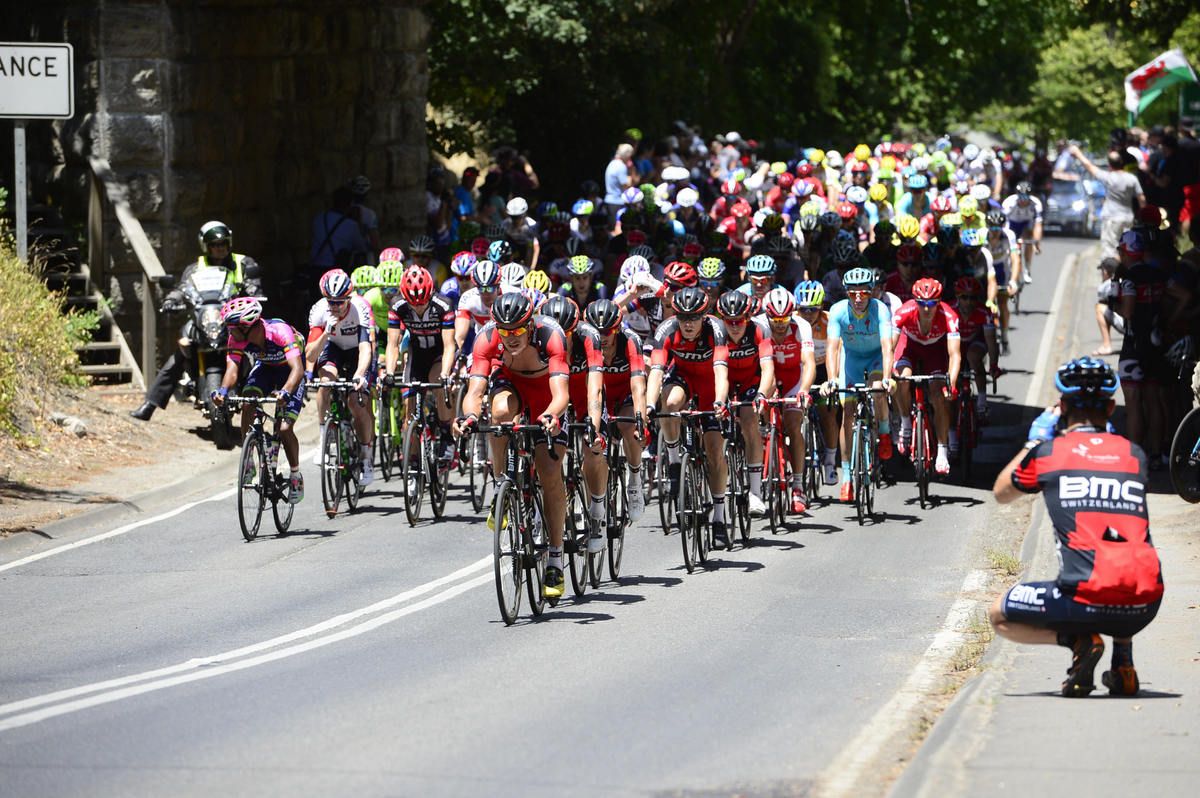 A BMC fan takes a photo of the BMC riders