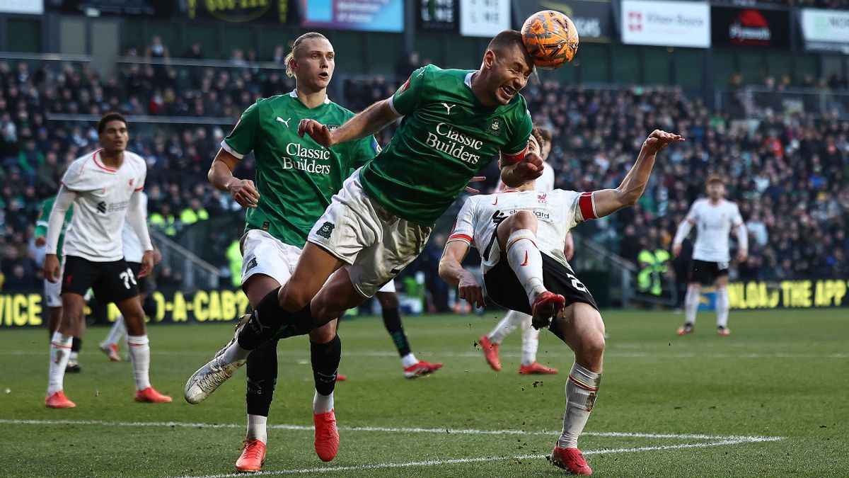 Plymouth Argyle player heads the ball on the way to the team&#039;s FA Cup victory over Liverpool