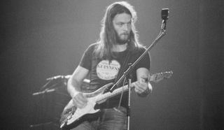 David Gilmour performs onstage with Pink Floyd in France in 1974