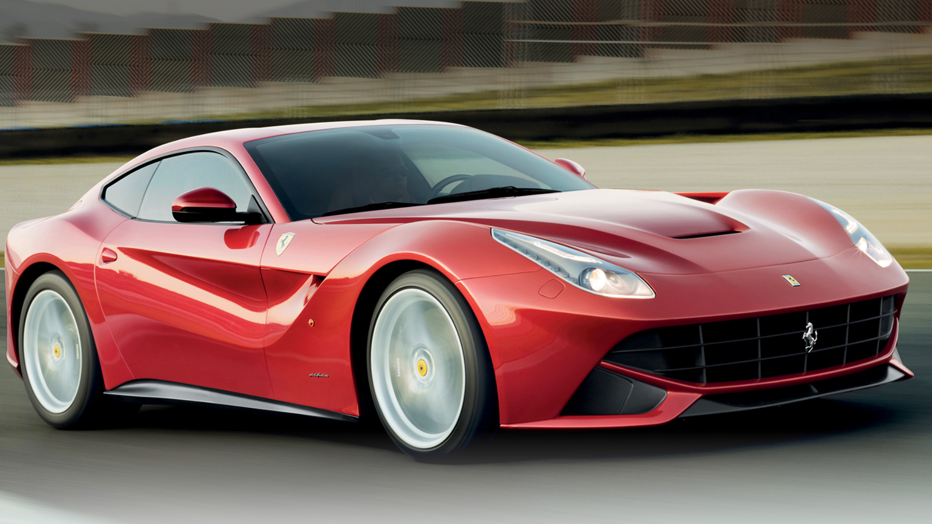 Ferrari F12 driving on a road