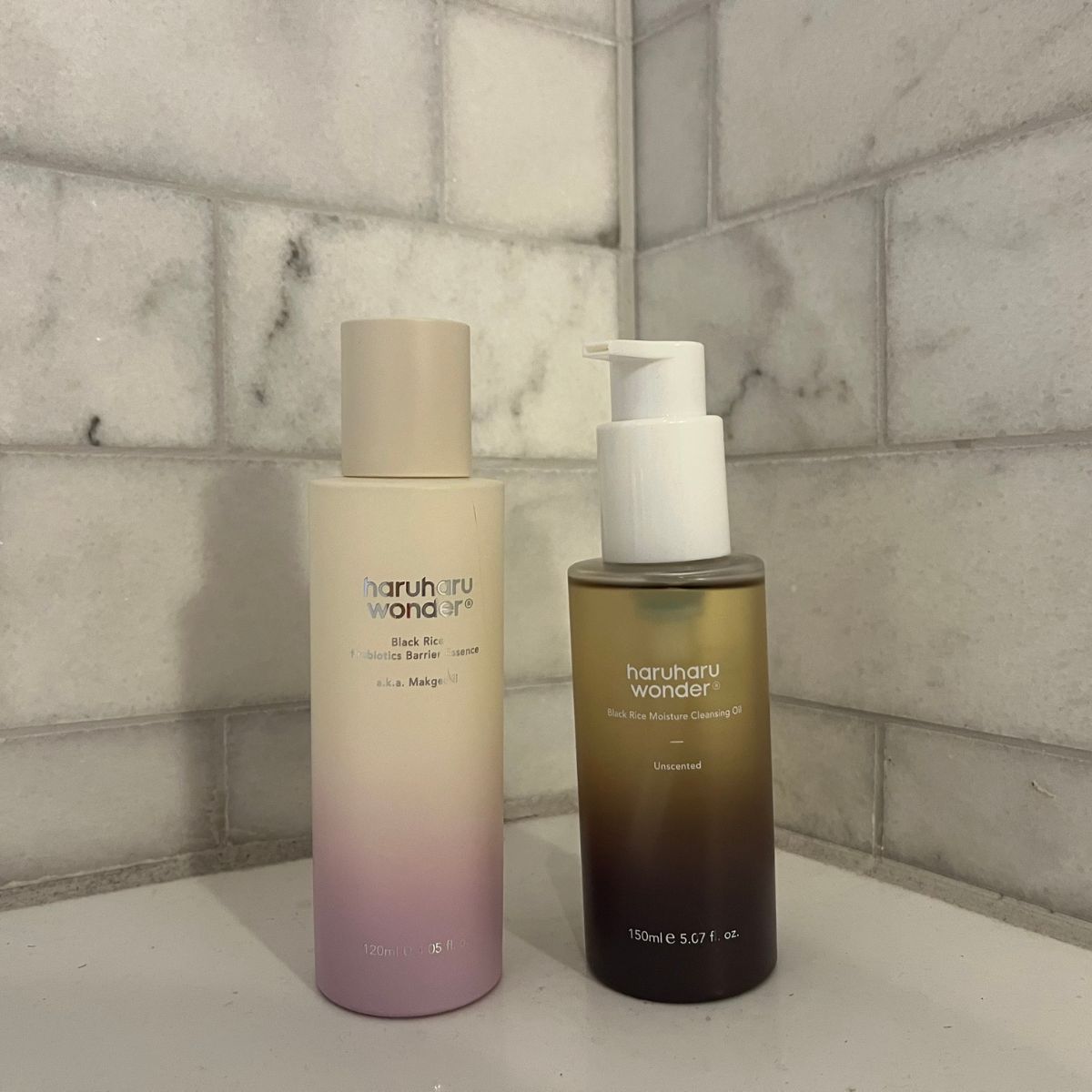 two haruharu wonder skincare products in front of grey tile