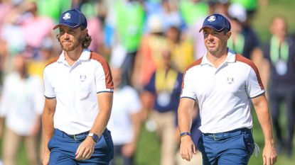Tommy Fleetwood of The European Team and his partner Rory McIlroy walk towards the 17th green in their match against Justin Thomas and Jordan Spieth during the Saturday morning foursomes matches of the 2023 Ryder Cup at Marco Simone Golf Club on September 30, 2023 in Rome, Italy.