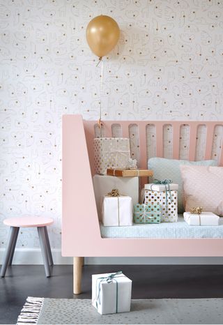 Pink cot by Little Interiors in a nursery