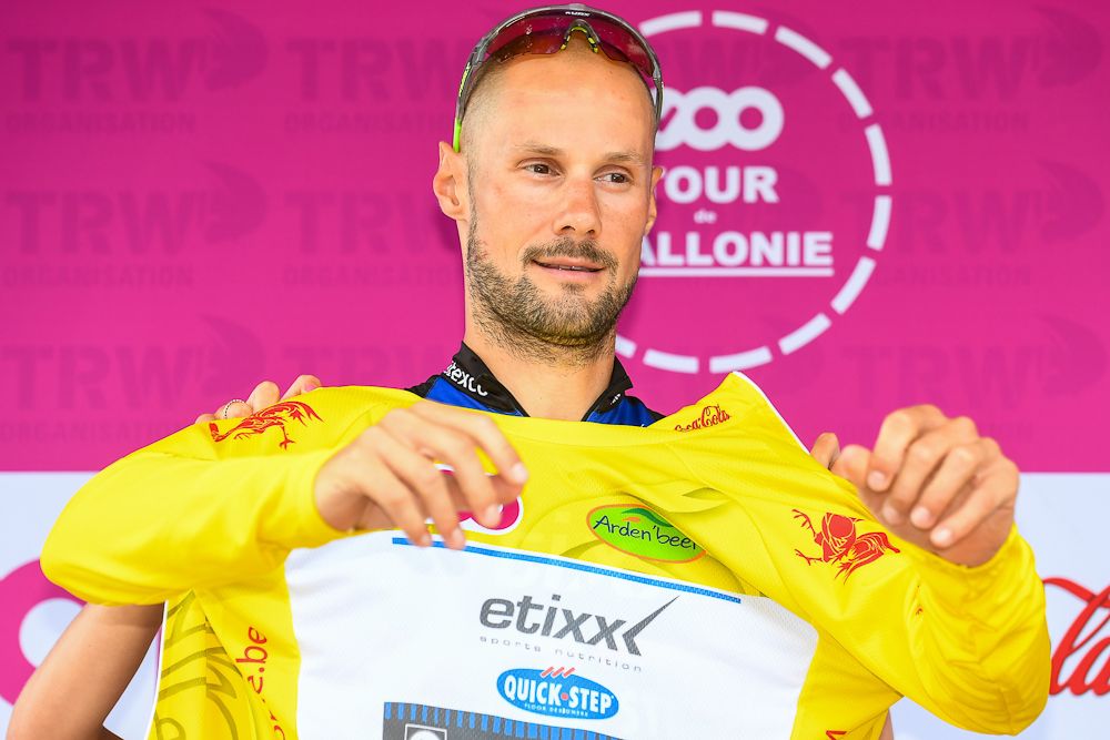 Belgium's Tom Boonen celebrates on the podium with the overall leader's yellow jersey after winning the first stage of the Tour de Wallonie