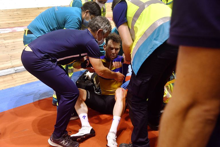 Mark Cavendish being helped to his feet after crashing on final day on Ghent Six Day 2021