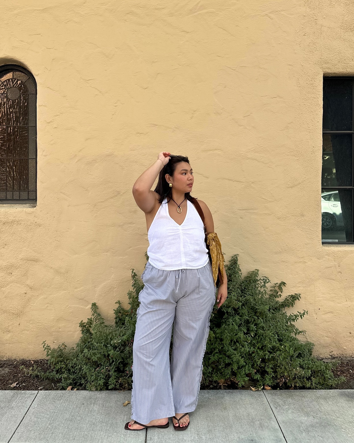 Influencer wears square toe flip flops.