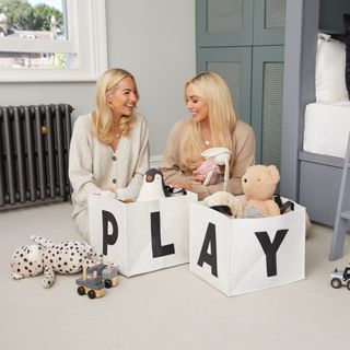 The Style Sisters organising toys in felt cream storage boxes