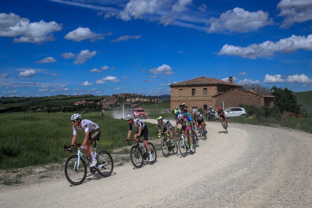 Team AG2R rider Belgiums Lawrence Naesen L and fellow breakaway riders pedal during the eleventh stage of the Giro dItalia 2021 cycling race 162 km between Perugia and Montalcino on May 19 2021 Photo by Luca Bettini AFP Photo by LUCA BETTINIAFP via Getty Images