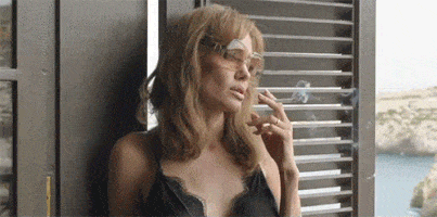 Angelina casually smoking a cigarette.