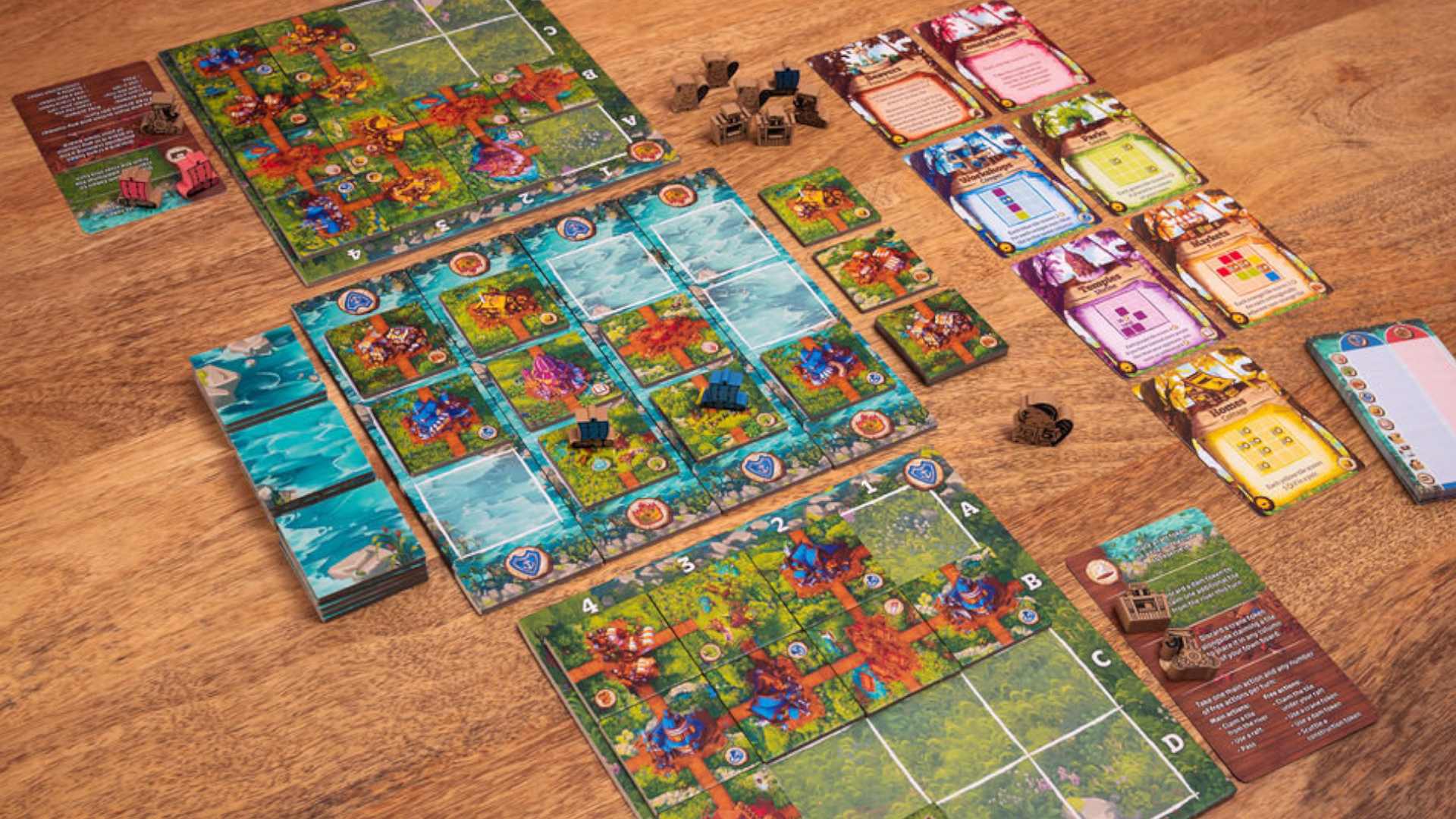 Timber Town board, cards, and pieces laid out on a wooden table