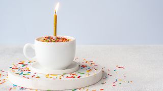 birthday cake protein mug cake with a candle
