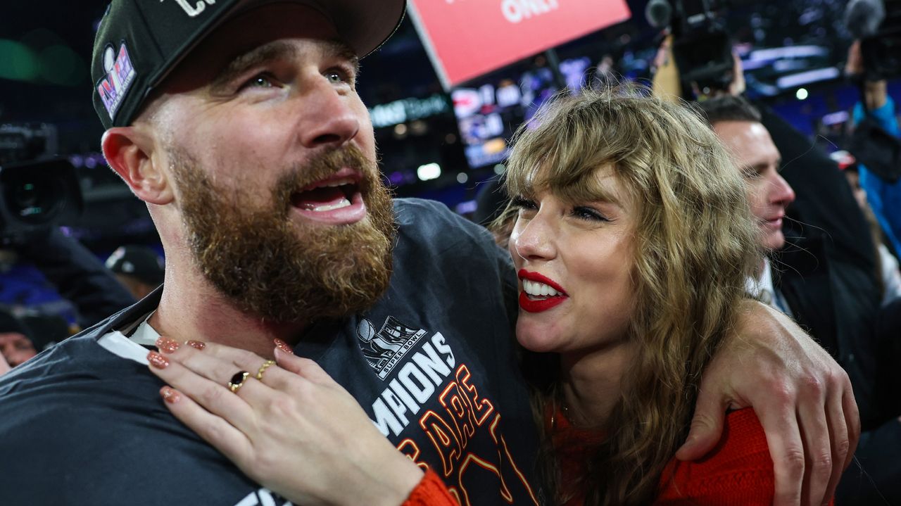 Travis Kelce #87 of the Kansas City Chiefs (L) celebrates with Taylor Swift after defeating the Baltimore Ravens in the AFC Championship Game.