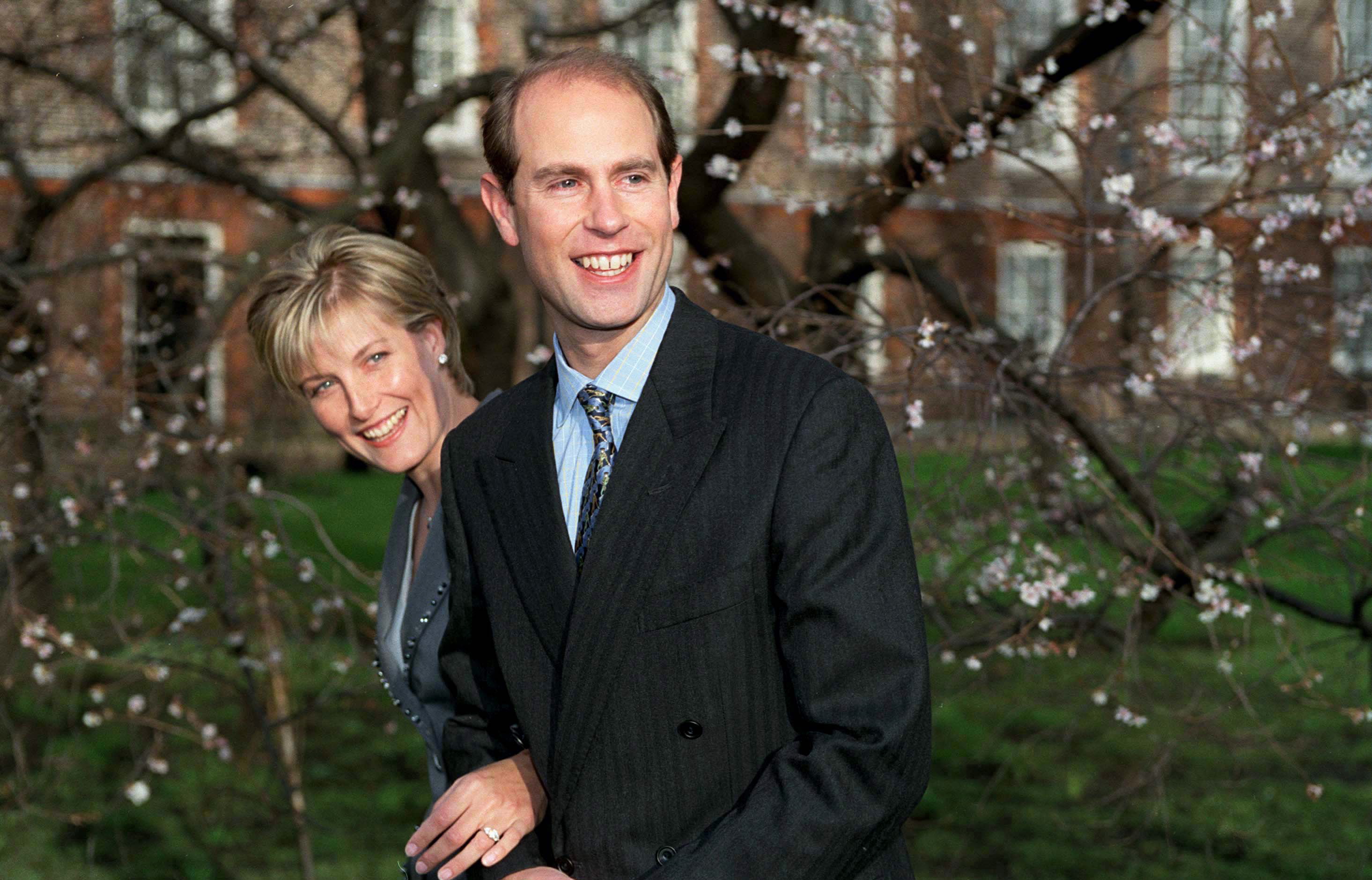 Duchess Sophie and Prince Edward smiling in front of a tree on their engagement day