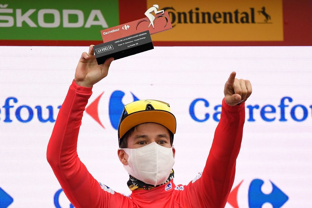 Team Jumbo-Visma&#039;s Slovenian rider Primoz Roglic celebrates on the podium with the overall leaders red jersey after the 16th stage of the 2020 La Vuelta cycling tour of Spain a 162km race from Salamanca to Ciudad Rodrigo on November 6 2020 Photo by OSCAR DEL POZO AFP Photo by OSCAR DEL POZOAFP via Getty Images