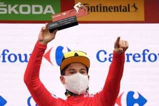 Team Jumbos Slovenian rider Primoz Roglic celebrates on the podium with the overall leaders red jersey after the 16th stage of the 2020 La Vuelta cycling tour of Spain a 162km race from Salamanca to Ciudad Rodrigo on November 6 2020 Photo by OSCAR DEL POZO AFP Photo by OSCAR DEL POZOAFP via Getty Images