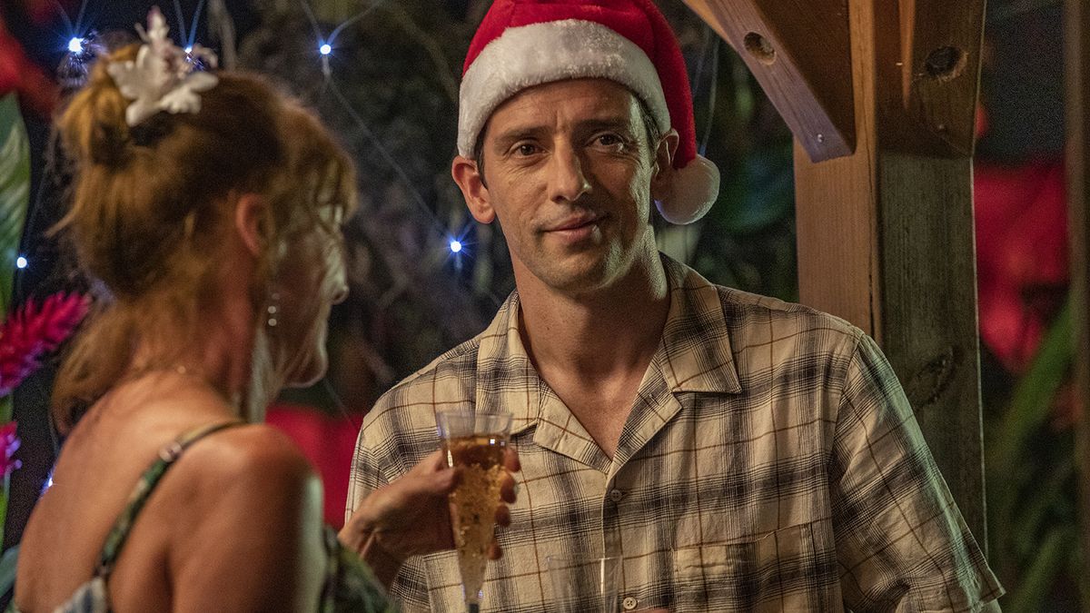 DI Neville Parker wearing a santa&#039;s hat in the Death in Paradise Christmas 2023 special