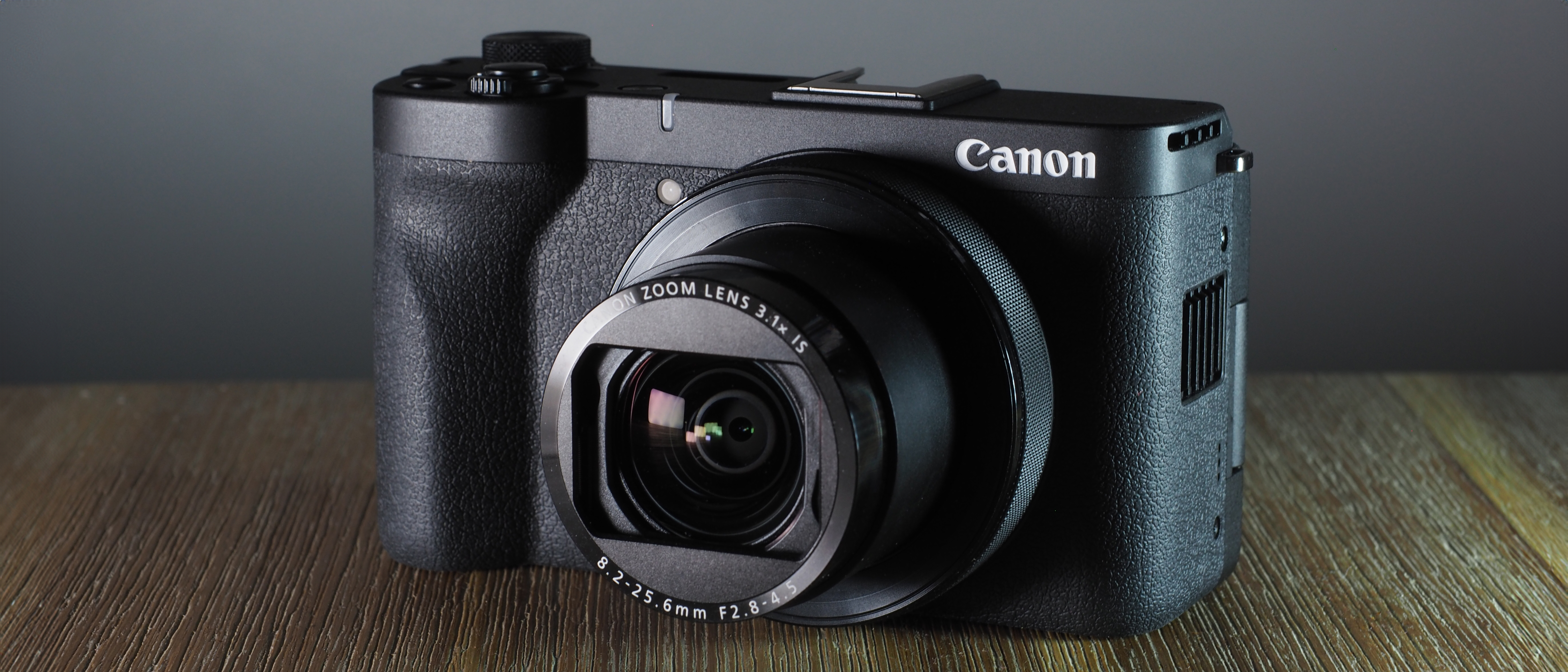 Canon PowerShot V1 on a wooden surface