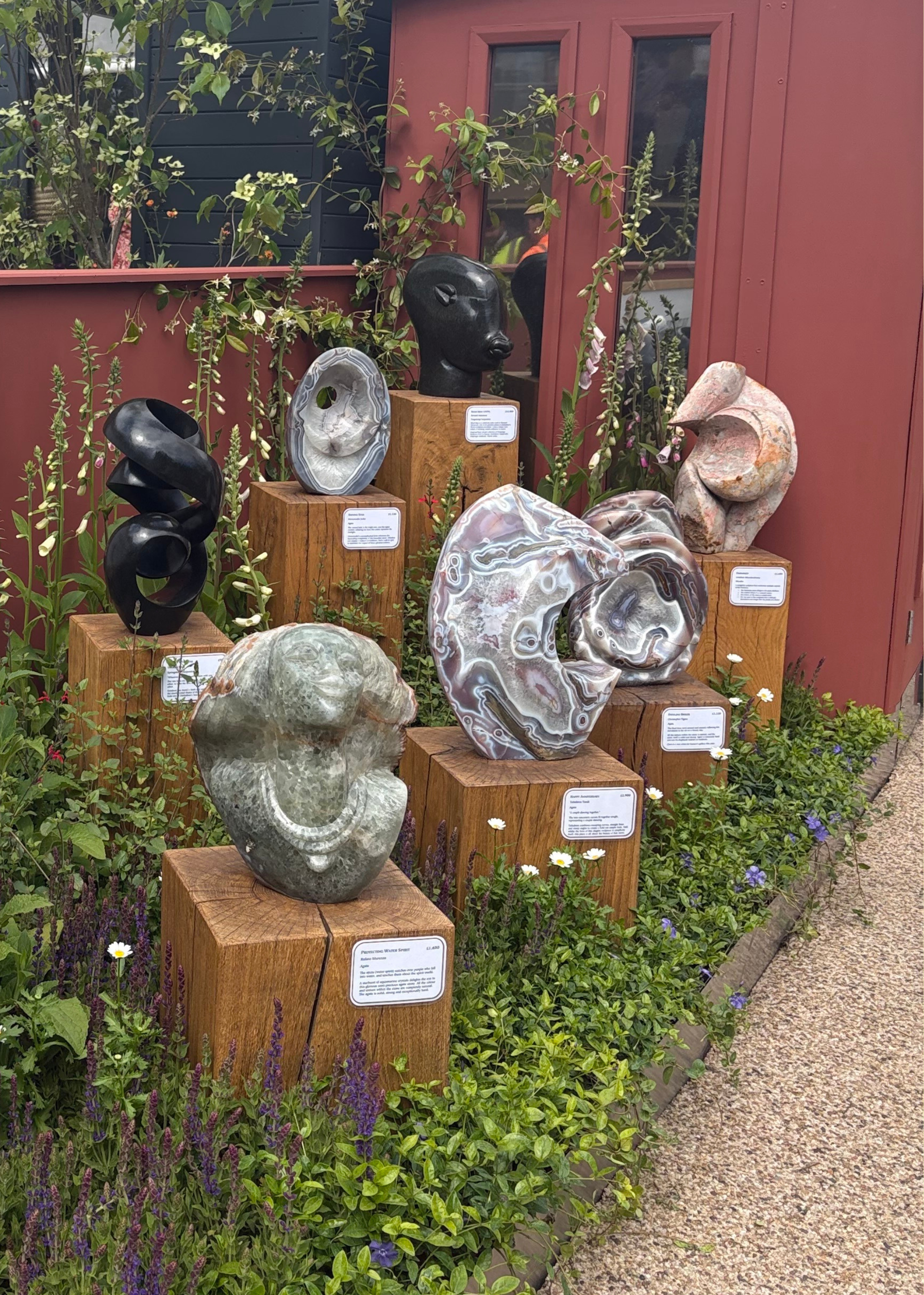 A row of marble sculptures by Guruve at the Chelsea Flower Show 2026