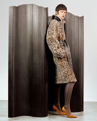 Pre Fall 2024 Best Looks Fashion Shoot featuring woman in leopard print coat against screen